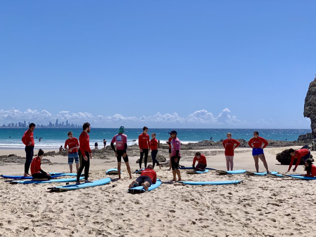 Kids and beginners at a learn to surf lesson near Currumbin Rock on the Gold Coast